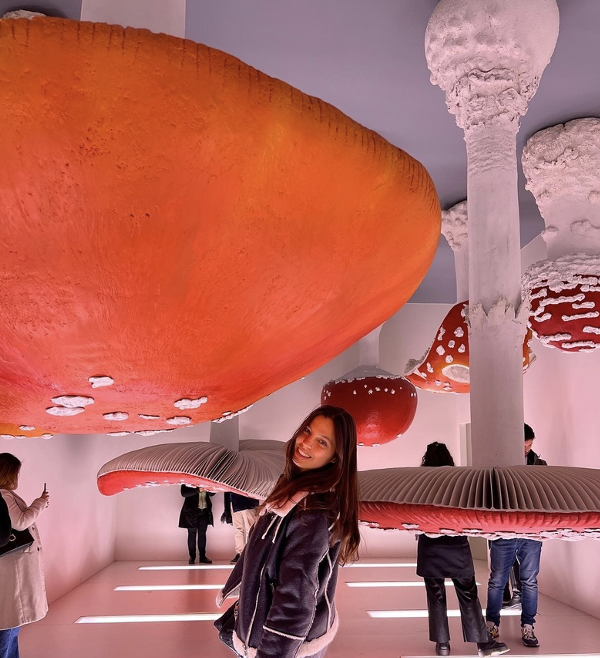 Maria in a museum with mushrooms on the ceiling
