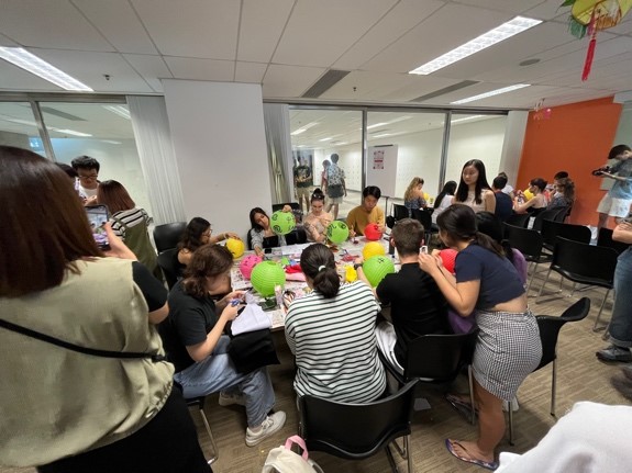 Group of people making lanterns