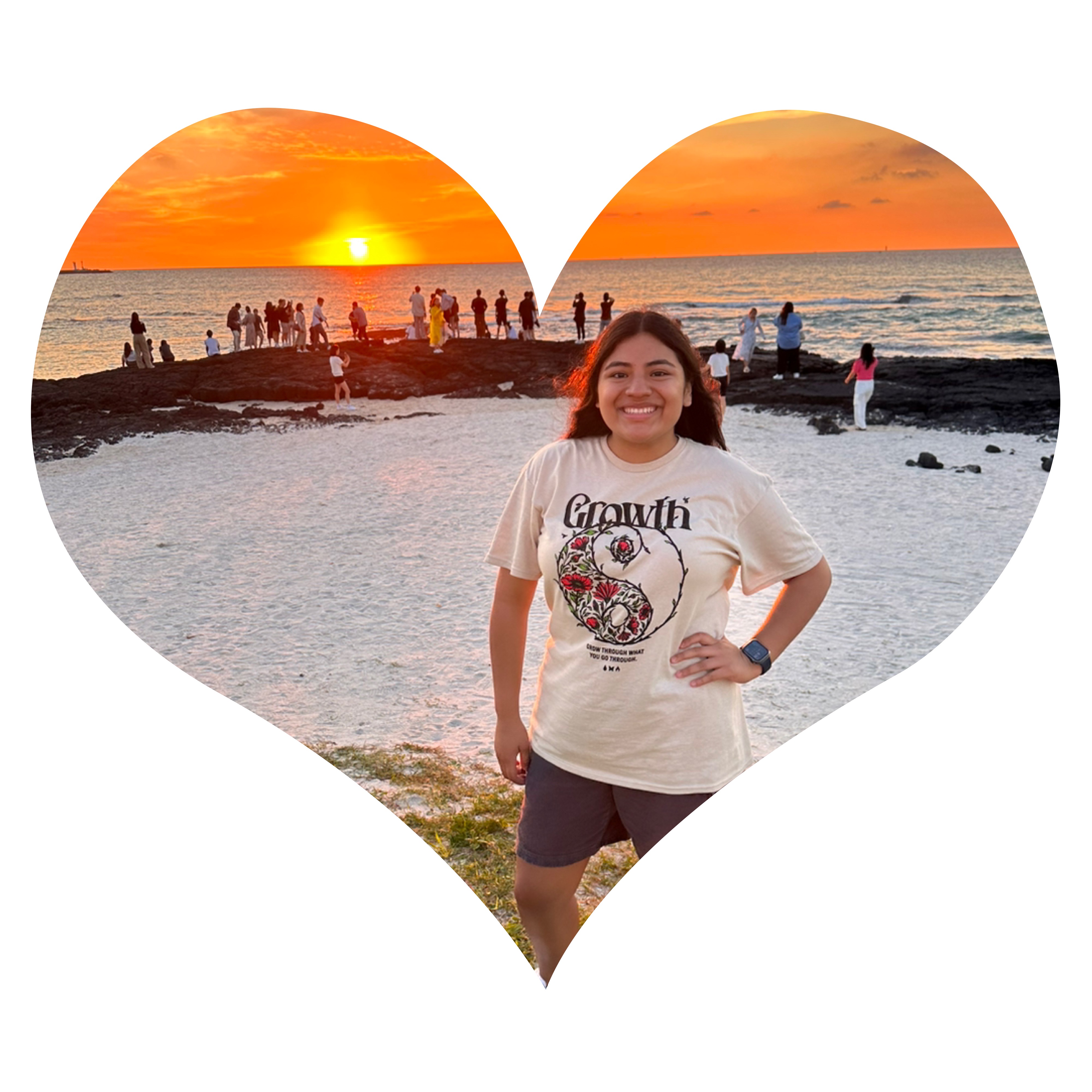 Jasmine Hernandez on a beach with a sunset in the background