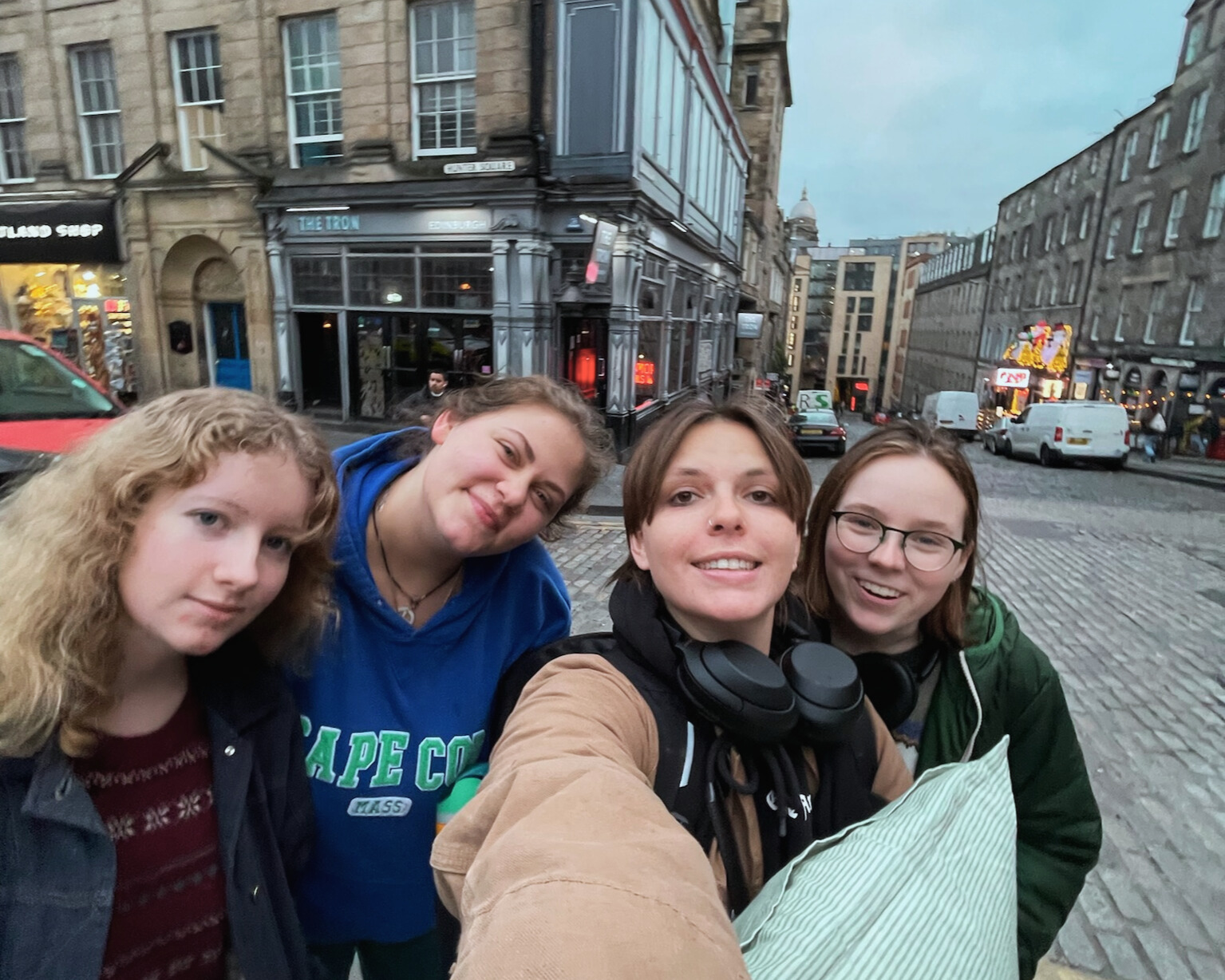 student taking a selfie with their groups of friends