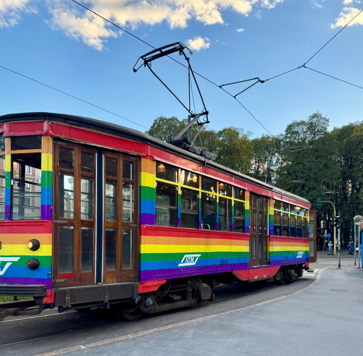 image of rainbow colored tram in Italy