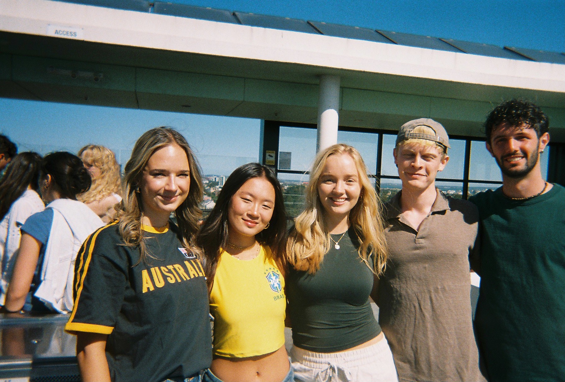 student posing with their friend group in Australia
