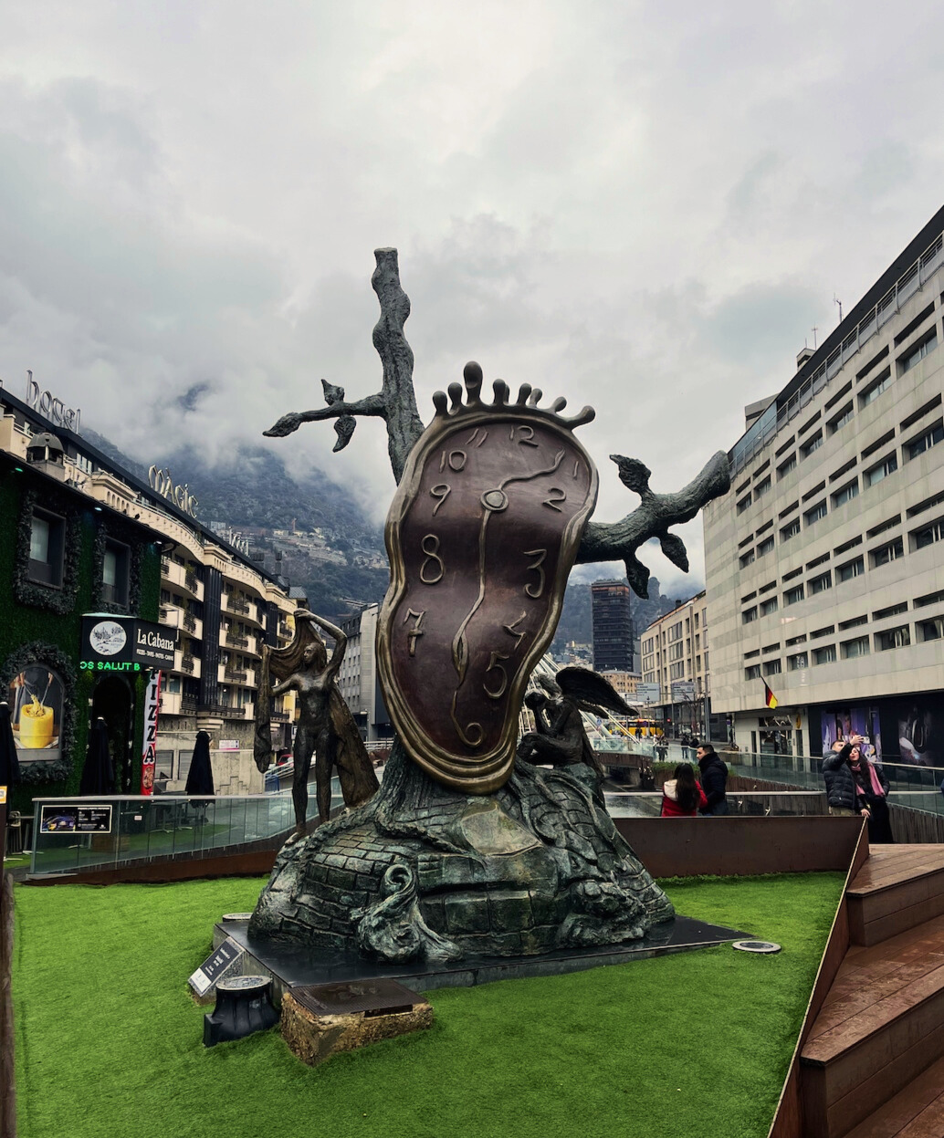 bronze monument in the middle of a plaza in Andorra 