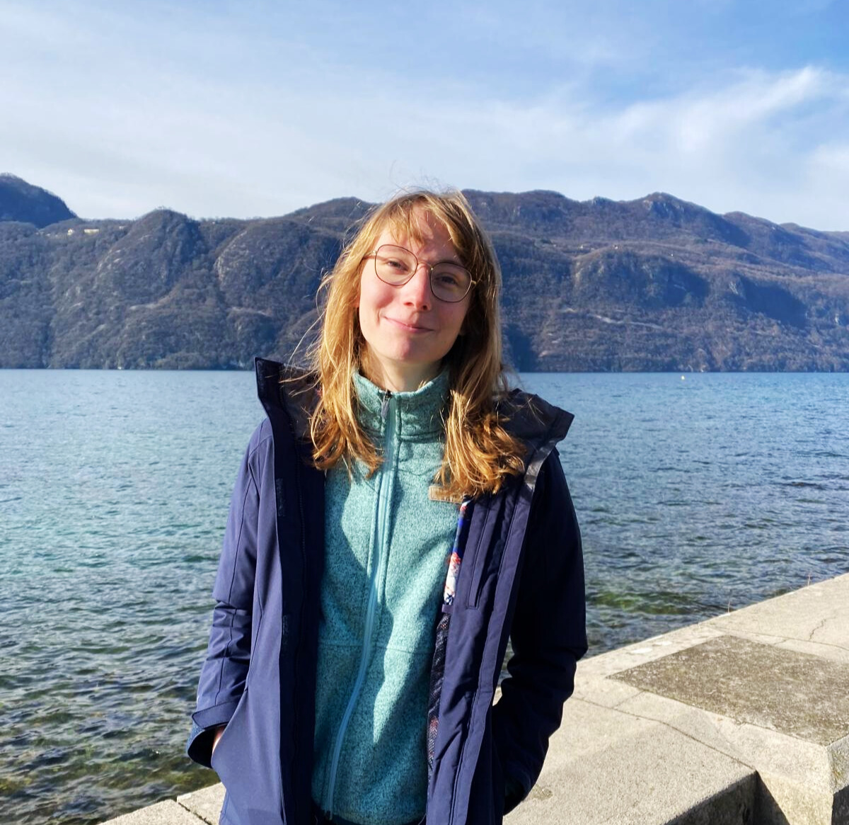 student with the lake in France view and mountain range on the background
