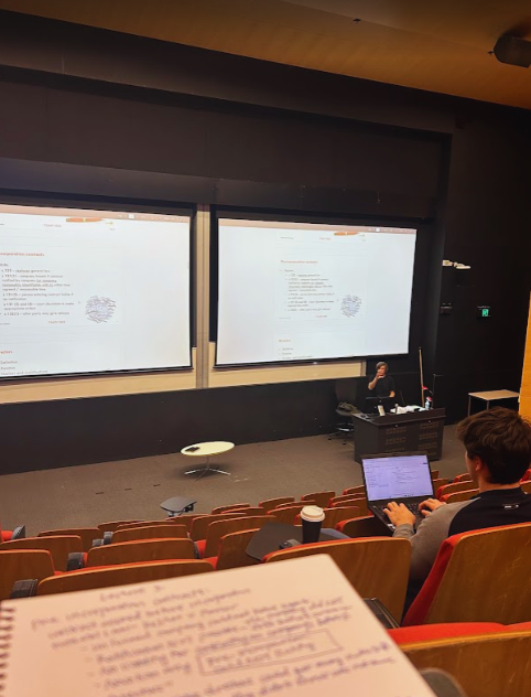 student sitting in a lecture hall