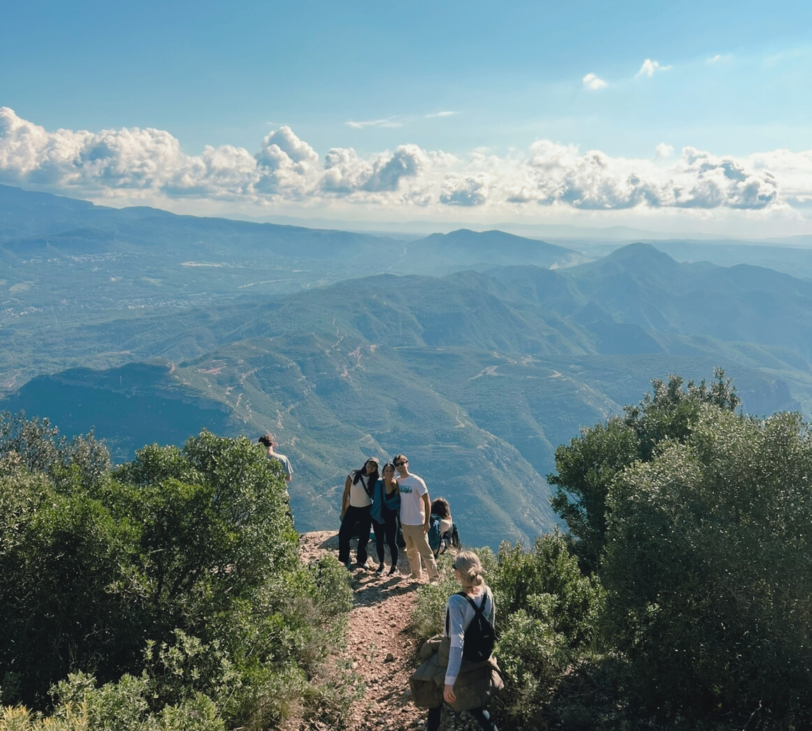 student on a hike exploring their local host country