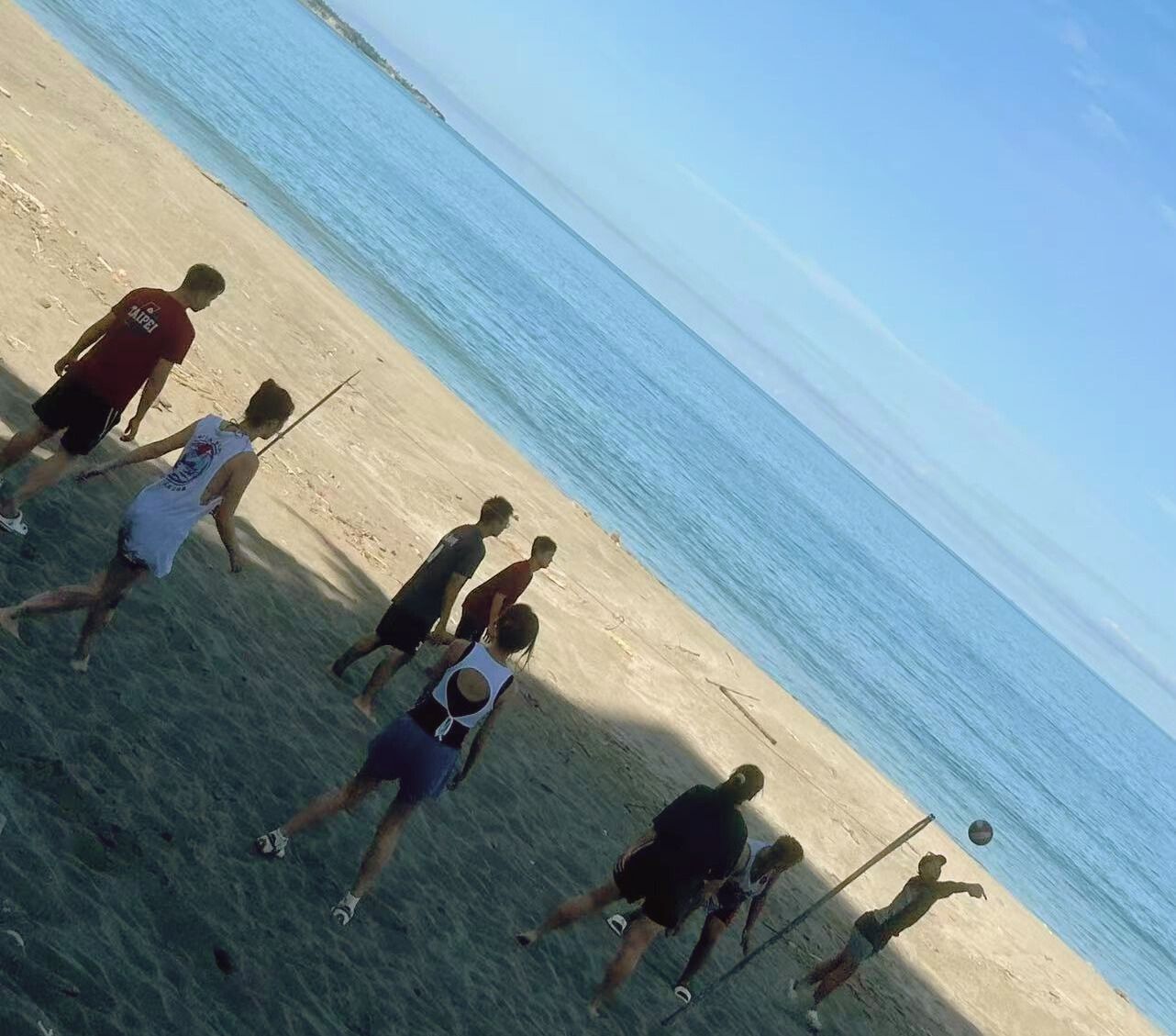student joining locals with Beach Volleyball in Taiwan