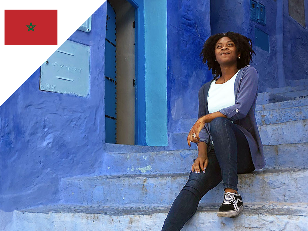 A woman sits on steps