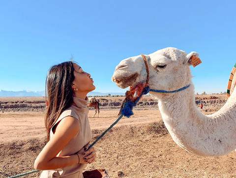 GW student Tiffany Guerrero with a camel.
