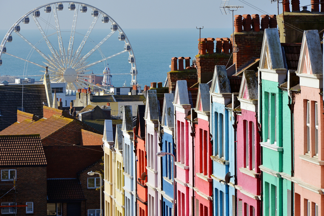 colorful houses abroad and ferris wheel