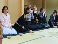 student participating in a Japanese tea ceremony