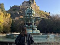 student standing in front of the water fountain at Edinburgh Castle is a historic castle in Edinburgh, Scotland.