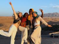 student with group of friends traveling