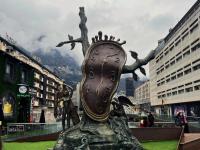 bronze monument in the middle of a plaza in Andorra 