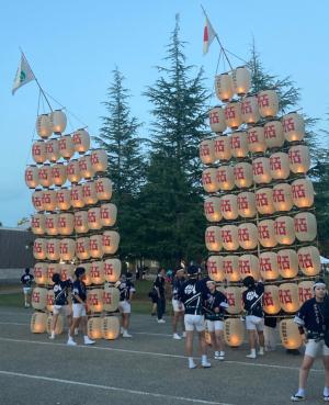 school club performing outside for visitors