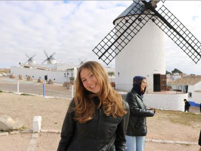 Isabella Banks poses in Spain with windmills in the background