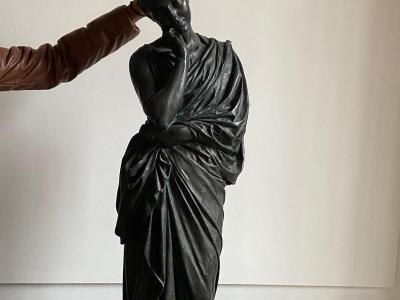 a fun photo giving bunny ears to a statue