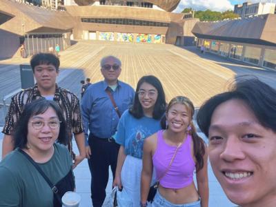 students posing in front of the Taipei Music Center