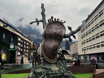 bronze monument in the middle of a plaza in Andorra