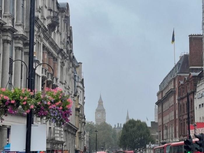A foggy. rainy day in London with city buildings and Big Ben seen in the background