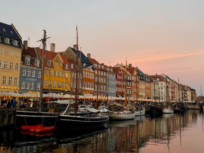 view of Denmark's Nyhavn Canal during sunset