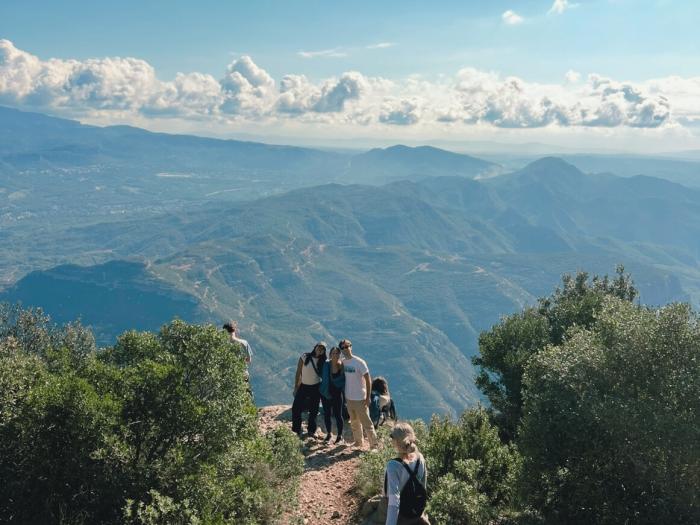 student on a hike exploring their local host country