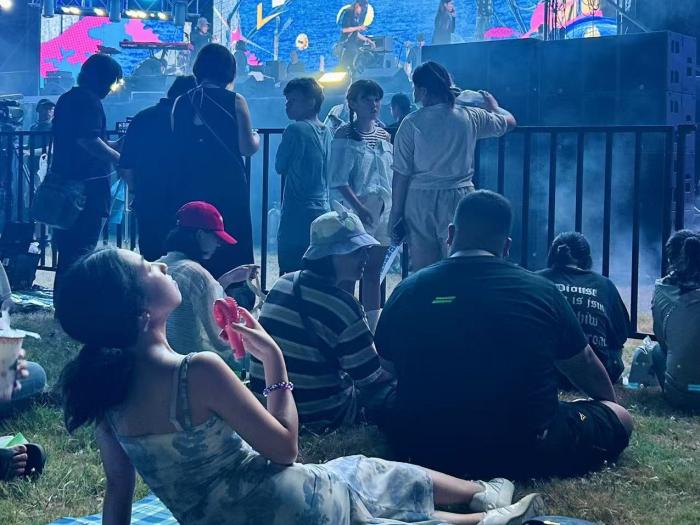 student attending a concert of their favorite Taiwanese band